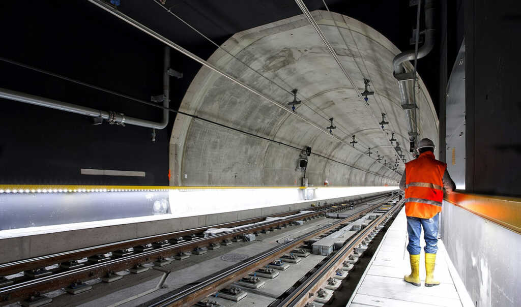 tunnel-construction-worker-orange-vest-yellow-boots